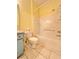 Cozy bathroom with a toilet, vanity, and bathtub/shower combination with tiled walls at 761 Tremont Greens Ln # 61, Sun City Center, FL 33573