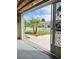 Exterior street view from inside open garage at 761 Tremont Greens Ln # 61, Sun City Center, FL 33573