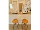 Eat-in kitchen area with granite countertops and seating for two at 761 Tremont Greens Ln # 61, Sun City Center, FL 33573