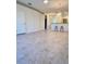 Bright living room featuring tile flooring, recessed lighting, and access to the kitchen bar at 761 Tremont Greens Ln # 61, Sun City Center, FL 33573
