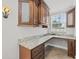 Home office with granite countertop and wood cabinets at 2707 W Leroy St, Tampa, FL 33607