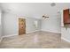 Large living room with tile floors and a wooden door at 2707 W Leroy St, Tampa, FL 33607
