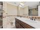 Bathroom featuring a double vanity and tile shower at 2707 W Leroy St, Tampa, FL 33607