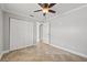 Bedroom with double door closet and tile floors at 2707 W Leroy St, Tampa, FL 33607