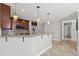 Modern kitchen with dark wood cabinets and granite countertops at 2707 W Leroy St, Tampa, FL 33607