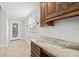 Home office with granite countertop and wood cabinets at 2707 W Leroy St, Tampa, FL 33607