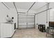 Garage with washer and dryer, extra storage space, and tiled floor at 2707 W Leroy St, Tampa, FL 33607