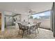 Outdoor kitchen with granite counters, stainless steel appliances, and a dining area at 2707 W Leroy St, Tampa, FL 33607