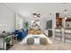 Bright living room with blue sofa and open kitchen at 2707 W Leroy St, Tampa, FL 33607