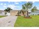 Home exterior, landscaped lawn, paved driveway at 2707 W Leroy St, Tampa, FL 33607