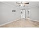 Spacious bedroom with ceiling fan and walk-in closet at 2707 W Leroy St, Tampa, FL 33607