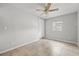 Bright bedroom with tiled floors, ceiling fan, and exterior access at 2707 W Leroy St, Tampa, FL 33607