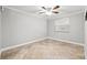 Well-lit bedroom featuring tile flooring and ceiling fan at 2707 W Leroy St, Tampa, FL 33607