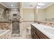Elegant bathroom with double vanity, tile shower and soaking tub at 2707 W Leroy St, Tampa, FL 33607
