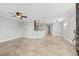 Open living room with tile floors and kitchen access at 2707 W Leroy St, Tampa, FL 33607