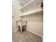 Laundry room features a utility sink and ample shelving at 761 Tremont Greens Ln # 61, Sun City Center, FL 33573