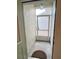 Small screened porch with a door to the backyard at 761 Tremont Greens Ln # 61, Sun City Center, FL 33573