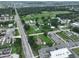 Aerial view of property and surrounding area near road and businesses at 11348 Pine St, Riverview, FL 33578