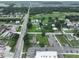 Aerial view showing property's location near a busy road and other homes at 11348 Pine St, Riverview, FL 33578