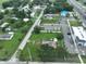 Aerial view of vacant lot near road and commercial development at 11348 Pine St, Riverview, FL 33578
