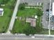 Aerial view of a house and lot situated near a road and other buildings at 11348 Pine St, Riverview, FL 33578