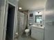 Clean bathroom with a white vanity and tiled shower at 2702 Campus Hill Dr, Tampa, FL 33612