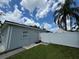 Gray shed with white vinyl fence and walkway at 2702 Campus Hill Dr, Tampa, FL 33612