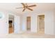 Spacious bedroom with ceiling fan and access to bathroom and closet at 4961 Grist Mill Cir, New Port Richey, FL 34655