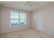 Spacious bedroom with large window and closet at 4961 Grist Mill Cir, New Port Richey, FL 34655