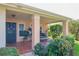 Inviting front porch with tiled flooring and seating at 4961 Grist Mill Cir, New Port Richey, FL 34655
