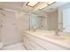 Bathroom boasts double vanity and a shower at 4961 Grist Mill Cir, New Port Richey, FL 34655