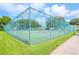 Well-maintained tennis court with chain link fence at 4961 Grist Mill Cir, New Port Richey, FL 34655