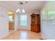 Light and airy dining room with hardwood floors and a view into the kitchen at 4961 Grist Mill Cir, New Port Richey, FL 34655