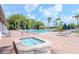 Community pool and spa with lounge chairs and patio area at 4961 Grist Mill Cir, New Port Richey, FL 34655