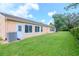 Spacious backyard with grassy lawn and privacy at 4961 Grist Mill Cir, New Port Richey, FL 34655