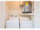 Laundry closet with washer, dryer, and water heater at 4961 Grist Mill Cir, New Port Richey, FL 34655