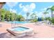 Relaxing pool and spa area with lounge chairs at 4961 Grist Mill Cir, New Port Richey, FL 34655