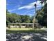 Single-story home with a large yard and mature trees at 3606 Autumn Palm Dr, Zephyrhills, FL 33541