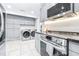 Modern kitchen with stainless steel appliances and gray cabinetry at 2102 E Annie St, Tampa, FL 33612