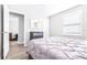 Well-lit bedroom with a comfortable bed and built-in shelving at 2102 E Annie St, Tampa, FL 33612