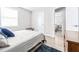Bedroom with ceiling fan, window blinds, and access to another room at 2102 E Annie St, Tampa, FL 33612