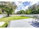 Spacious backyard with deck and large grassy area at 2102 E Annie St, Tampa, FL 33612