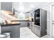 Modern kitchen with gray cabinets and stainless steel appliances at 2102 E Annie St, Tampa, FL 33612