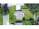 Aerial view showing house, yard, and surrounding neighborhood at 2102 E Annie St, Tampa, FL 33612