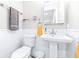 Clean bathroom with pedestal sink and subway tile at 2102 E Annie St, Tampa, FL 33612
