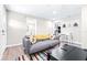 Living room with gray couch and view of kitchen at 2102 E Annie St, Tampa, FL 33612