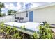 Back deck with small table and chairs, next to house at 2102 E Annie St, Tampa, FL 33612