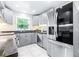 Updated kitchen with gray cabinets and stainless steel appliances at 2102 E Annie St, Tampa, FL 33612