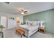 Bright bedroom with a king-size bed and en-suite bathroom access at 13305 Great Plains Dr, Riverview, FL 33579