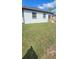 Expansive backyard offers ample space for outdoor activities and relaxation with a modest back porch at 3001 E 25Th Ave, Tampa, FL 33605